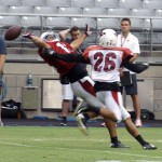 Receiver Michael Floyd can't come up with the catch against safety Rashad Johnson's defense during Arizona Cardinals training camp July 29, 2014. (Adam Green/Arizona Sports)