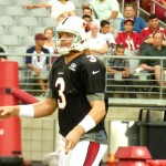 Quarterback Carson Palmer looks downfield after delivering a pass during Arizona Cardinals training camp at University of Phoenix Stadium in Glendale. (Photo: Vince Marotta/Arizona Sports)