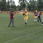 Arizona State quarterback Taylor Kelly going through drills with offensive coordinator Mike Norvell. (Craig Grialou/Arizona Sports)