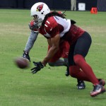 Larry Fitzgerald and Patrick Peterson battle for position as a pass arrives during Cardinals training camp at University of Phoenix Stadium Aug. 14, 2014. (Photo: Adam Green/Arizona Sports)