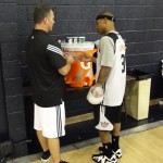 Phoenix Suns point guard Isaiah Thomas (3) talks with head athletic trainer Aaron Nelson during training camp in Flagstaff, Ariz., on Tuesday, Sept. 30, 2014. (Photo: Craig Grialou/Arizona Sports)