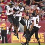 Arizona State wide receiver Gary Chambers (81) celebrates teammate wide receiver Jaelen Strong's (21) touchdown during the first half of an NCAA college football game against Southern California, Saturday, Oct. 4, 2014, in Los Angeles. (AP Photo/Gus Ruelas)