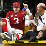 Arizona Cardinals quarterback Carson Palmer leaves the field on a cart holding his right knee following an injury during an NFL football game against the St. Louis Rams on Sunday, Nov. 9, 2014 in Glendale, Ariz. (AP Photo/The Republic, Rob Schumacher)