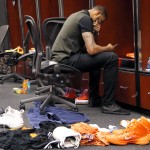 Phoenix Suns' Markieff Morris sits in the locker room after an NBA basketball game against the Memphis Grizzlies, Monday, April 14, 2014, in Phoenix. The Grizzlies won 97-91 eliminating the Suns from the playoffs. (AP Photo/Matt York)