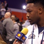 Akeem Ayers of the New England Patriots chats with a member of the media during Super Bowl Media Day Tuesday, Jan. 27, at the US Airways Center. (Photo by Adam Green/Arizona Sports)