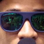 A reflection of the media can be seen in Seahawks safety Earl Thomas' glasses during Super Bowl Media Day Tuesday, Jan. 27, at the US Airways Center. (Photo by Adam Green/Arizona Sports)