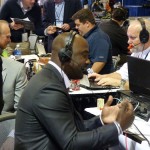Pro Football Hall of Famer Marshall Faulk conducts an interview in Radio Row at the Phoenix Convention Center. (Photo: Vince Marotta/Arizona Sports)