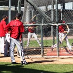 Position players take batting practice prior to departure. (Photo by Stephen DeLorenzo/Cronkite News)