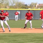 Infielders work on base running and fielding during batting practice. (Photo by Stephen DeLorenzo/Cronkite News)