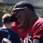 Outfielder Socrates Brito signs autographs for fans. (Photo by Stephen DeLorenzo/Cronkite News)