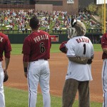 Baxter stands alongside his team during the national anthem. Photo by Stephen DeLorenzo