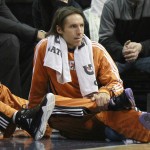 Phoenix Suns point guard Steve Nash (13) sits on the sideline while playing the Denver Nuggets during the first half of an NBA basketball game in Denver Tuesday, Jan. 11, 2011. (AP Photo/Barry Gutierrez)