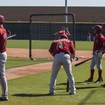 Minor leaguers prepare for batting practice. (Photo by Stephen DeLorenzo/Cronkite News)