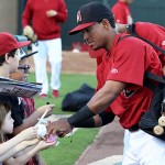 Minor leaguer Alvaro Rondon gets his first taste of signing autographs with the big league club before the D-backs game against the Brewers. Photo by Zachary Holland/Cronkite News