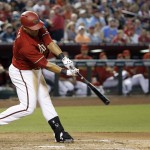 Arizona Diamondbacks' Yasmany Tomas swings on an RBI triple against the Los Angeles Angels during the third inning of a baseball game Wednesday, June 17, 2015, in Phoenix. (AP Photo/Ross D. Franklin)