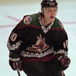 Away (1996-2003)

When the Coyotes arrived in the Valley, NHL teams wore dark jerseys on the road. This was the Coyotes' away look for seven seasons. The black jersey featured the kachina coyote logo, hunter green shoulders and unique trim in a Southwestern design in sand, brick and green. The Coyotes quarter moon logo adorned each shoulder.

The team wore these uniforms for one game in the 2014-15 season.
