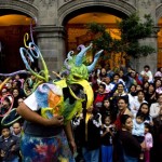 A man dressed as an Alebrije takes part in a parade in Mexico City, Saturday, Oct. 20, 2007. Alebrijes are brightly-colored Mexican folk art sculptures of fantastical animal-like creatures. (AP Photo/Eduardo Verdugo)