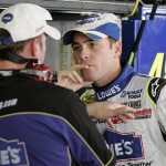 Jimmie Johnson, right, talks with crew chief Chad Knaus during practice Friday, Nov. 9, 2007, in Avondale, Ariz., for Sunday's NASCAR Nextel Cup Checker Auto Parts 500 auto race. (AP Photo/Jason Babyak)