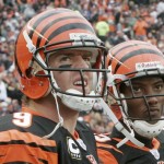Cincinnati Bengals quarterback Carson Palmer, left, looks at the scoreboard with receiver Chris Henry in the second half of an NFL football game against the Arizona Cardinals, Sunday, Nov. 18, 2007, in Cincinnati. Palmer threw four interceptions in the game won by Arizona, 35-27. (AP Photo/David Kohl)