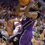 Sacramento Kings forward John Salmons (15) grabs a rebound in front of Phoenix Suns forward Shawn Marion (31) in the first quarter of an NBA basketball game Wednesday, Nov. 21, 2007, in Phoenix. (AP Photo/Paul Connors)