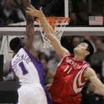 Phoenix Suns' Amare Stoudemire, left, dunks over Houston Rockets' Yao Ming, of China, in the first quarter of an NBA basketball game Wednesday, Nov. 28, 2007, in Phoenix. (AP Photo/Ross D. Franklin)