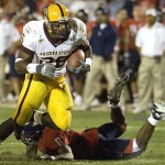 ASU's Alex King breaks a tackle by Arizona's Dominic Patrick during the third quarter at Arizona Stadium in 2006.

John Miller/The Associated Press