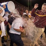 ASU coach Dirk Koetter avoids a water bath from ASU's Javon Williams in 2006.

Wily Low/The Associated Press 