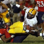 ASU Ryan Torain is tackled by Arizona's Dominic Patrick during the second half in 2006.

Wily Low/The Associated Press 