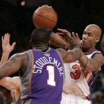 New York Knicks guard Stephon Marbury (3) battles with Phoenix Suns center Amare Stoudemire (1) for the ball in the second half of an NBA basketball game in New York, Sunday, Dec. 2, 2007. (AP Photo/Kathy Willens)