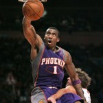 Phoenix Suns center Amare Stoudemire (1) dunks the ball over New York Knicks forward David Lee in the fourth quarter of the Suns 115-104 NBA basketball victory over the Knicks in New York, Sunday, Dec. 2, 2007. Stoudemire and Grant Hill both had 28 points in the game. (AP Photo/Kathy Willens)