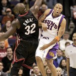 Phoenix Suns forward Shawn Marion passes over Miami Heat center Shaquille O'Neal during the first quarter of an NBA basketball game Monday. (AP Photo/Matt York)