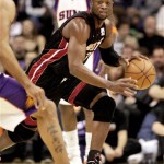 Miami Heat guard Dwyane Wade pushed the ball upcourt against the Phoenix Suns during the first quarter of an NBA basketball game Monday. (AP Photo/Matt York)