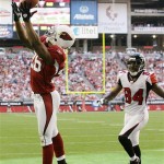 Arizona Cardinals' Roderick Hood, left, makes an interception in the end zone on a pass intended for Atlanta Falcons' Roddy White (84) in the first quarter of an NFL football game Sunday, Dec. 23, 2007 in Glendale, Ariz. (AP Photo/Paul Connors)
