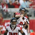 Atlanta Falcons' Chris Redman throws a pass against the Arizona Cardinals while getting blocking help from Warrick Dunn (28) in the first quarter of an NFL football game Sunday, Dec. 23, 2007, in Glendale, Ariz. (AP Photo/Ross D. Franklin)
