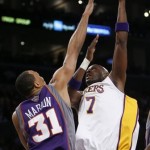 Los Angeles Lakers' Lamar Odom (7) goes up against Phoenix Suns' Shawn Marion (31) in first half of their NBA basketball game, Tuesday, Dec. 25, 2007 in Los Angeles. (AP Photo/Gus Ruelas)