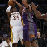Los Angeles Lakers' Kobe Bryant (24) shoots for two over Phoenix Suns' Shawn Marion in first half of their NBA basketball game, Tuesday, Dec. 25, 2007 in Los Angeles. (AP Photo/Gus Ruelas)
