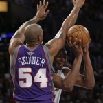 Los Angeles Lakers' Andrew Bynum, right, tries to get by Phoenix Suns' Brian Skinner (54) in first half of their NBA basketball game, Tuesday, Dec. 25, 2007 in Los Angeles. (AP Photo/Gus Ruelas)