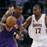 Phoenix Suns' Amare Stoudemire (1) tries to hold on to the ball as he drives by Los Angeles Lakers' Andrew Byum (17) in the first half of their NBA basketball game, Tuesday, Dec. 25, 2007 in Los Angeles. The Lakers won 122-115. (AP Photo/Gus Ruelas)