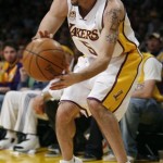 Los Angeles Lakers' Jordan Farmar (5) attempts to keep the ball in bounds in second half of their NBA basketball game against the Phoenix Suns, Tuesday, Dec. 25, 2007 in Los Angeles. The Lakers won 122-115. (AP Photo/Gus Ruelas)