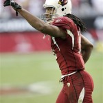 Arizona Cardinals wide receiver Larry Fitzgerald celebrates his first touchdown against the St. Louis Rams during the second quarter of an NFL football game Sunday, Dec. 30, 2007 in Glendale, Ariz. (AP Photo/Matt York)