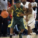 Oregon's Tajuan Porter (12) tries to drive around Arizona's Nic Wise, right, in the second half of a college basketball game at McKale Center in Tucson, Ariz., Saturday, Jan. 5, 2008. Oregon won 84-74. (AP Photo/Wily Low)
