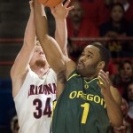 Oregon's Malik Hairston (1) and Arizona's Chase Budinger (34) battle for a rebound in the first half of a college basketball game at McKale Center in Tucson, Ariz., Saturday, Jan. 5, 2008. Oregon won 84-74. (AP Photo/Wily Low)