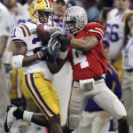 LSU cornerback Chevis Jackson (21) intercepts a pass intended for Ohio State wide receiver Ray Small (4) in the first half of the BCS championship college football game at the Louisiana Superdome in New Orleans, Monday, Jan. 7, 2008. (AP Photo/Keith Srakocic)
