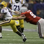 LSU wide receiver Trindon Holliday (8) is tackled by Ohio State defensive end Robert Rose (9) in the second quarter of the BCS championship college football game at the Louisiana Superdome in New Orleans, Monday, Jan. 7, 2008. (AP Photo/Charlie Riedel)
