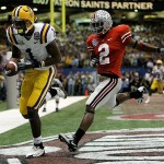 LSU wide receiver Brandon LaFell (1) scores on a 10-yard pass in the second quarter as Ohio State cornerback Malcolm Jenkins (2) tries to defend during the BCS championship college football game at the Louisiana Superdome in New Orleans, Monday, Jan. 7, 2008. (AP Photo/Nam Y. Huh)
