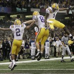 LSU tight end Richard Dickson, center, is congratulated by wide receiver Demetrius Byrd (2) and wide receiver Brandon LaFell (1) in the first half against Ohio State during the BCS championship college football game at the Louisiana Superdome in New Orleans, Monday, Jan. 7, 2008. (AP Photo/Charlie Riedel)