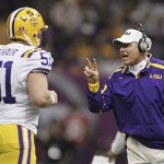 LSU coach Les Miles, right, talks with Jacob O'Hair (51) during the BCS championship college football game against Ohio State in the first half at the Louisiana Superdome in New Orleans, Monday, Jan. 7, 2008. (AP Photo/Rob Carr)