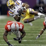 LSU wide receiver Early Doucet, top, is upended by Ohio State defensive back Donald Washington (20) during the first half of the BCS championship college football game at the Louisiana Superdome in New Orleans, Monday, Jan. 7, 2008. (AP Photo/Chuck Burton)