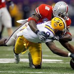 LSU wide receiver Early Doucet (9) reaches for a pass that falls incomplete as Ohio State cornerback Malcolm Jenkins (2) hits him in the first quarter during the BCS championship college football game at the Louisiana Superdome in New Orleans, Monday, Jan. 7, 2008. (AP Photo/Nam Y. Huh)