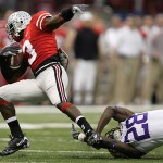 LSU defensive back Joe Maltempi (28) trips Ohio State running back Brandon Saine (3) in the first quarter during the BCS championship college football game at the Louisiana Superdome in New Orleans, Monday, Jan. 7, 2008. (AP Photo/Rob Carr)